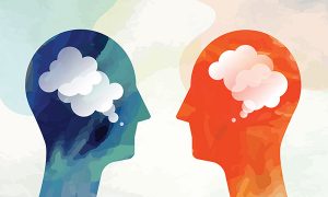 Two Heads Facing Communication Concept